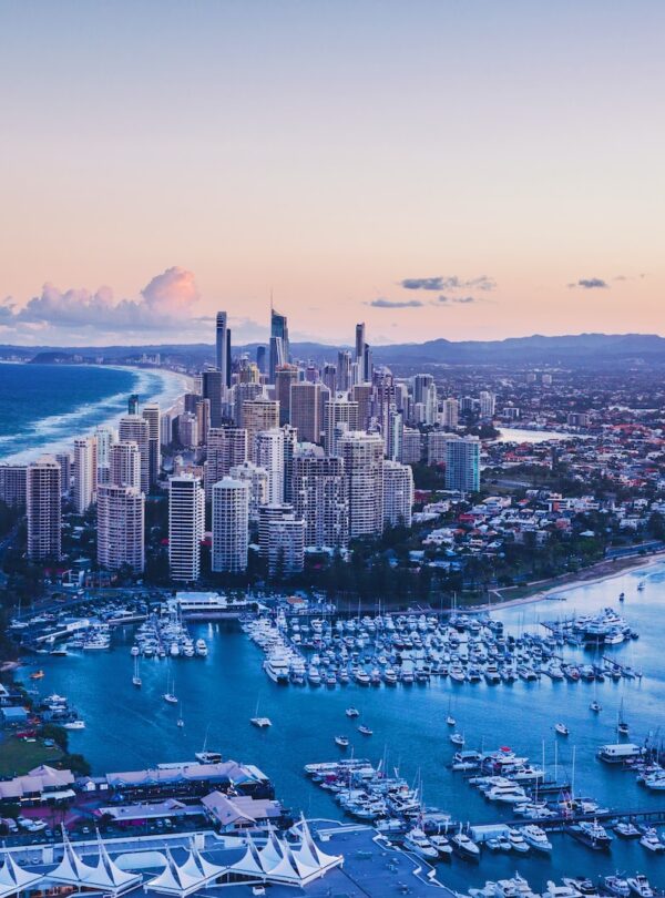 aerial view of city buildings near body of water during daytime